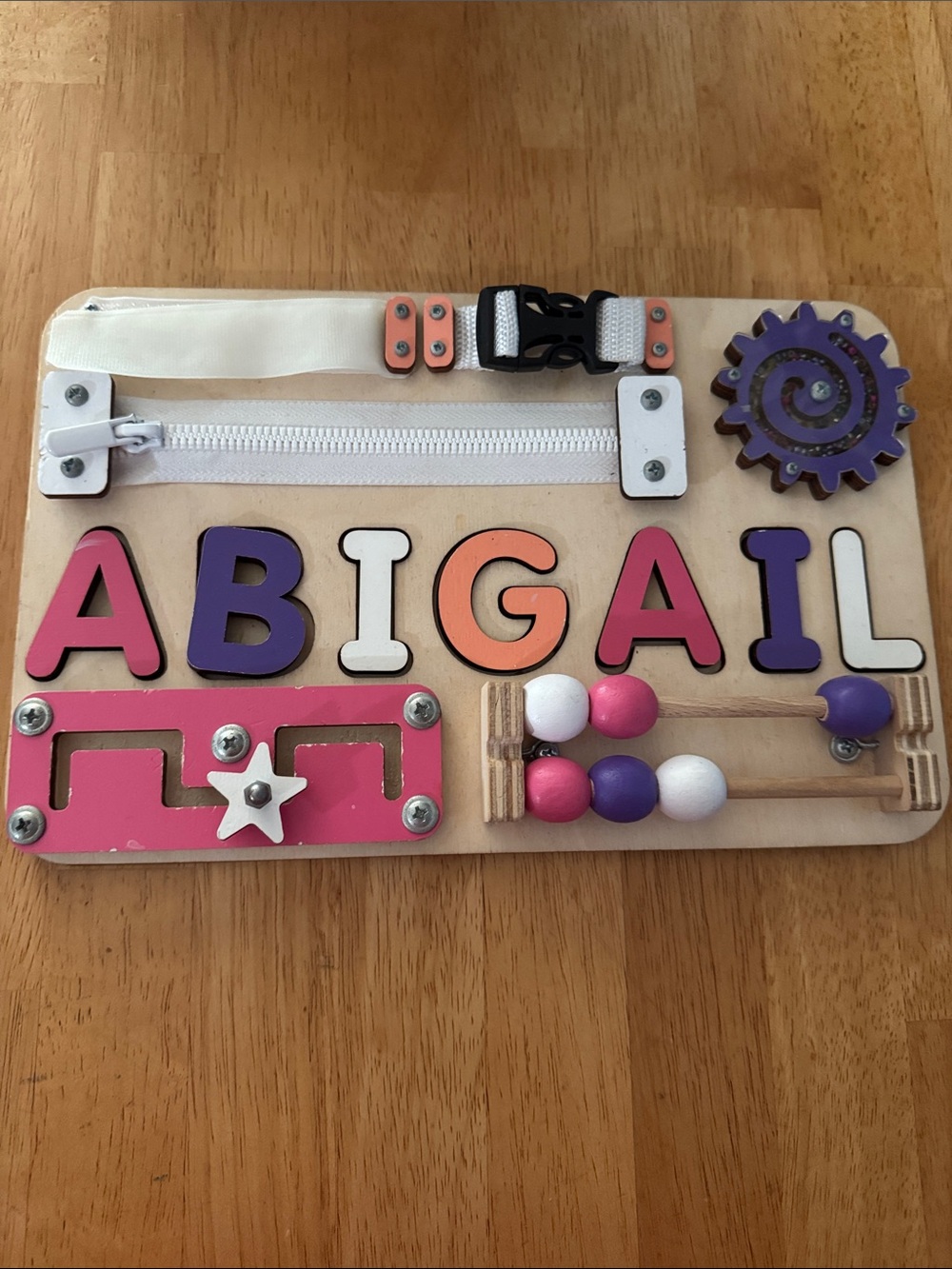 Personalized Abigail Wooden Busy Board - Pink, Purple, White, Orange